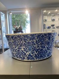 An exceptionally large Chinese blue and white basin with floral scrolls, Kangxi