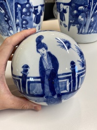 A pair of large Chinese blue and white jars and covers with ladies playing a game of go, 19th C.