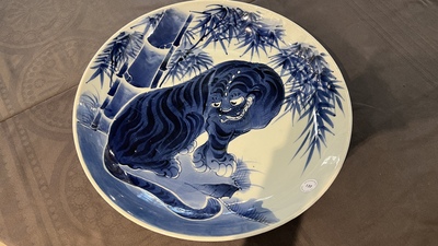 A large Japanese Arita blue and white 'tiger' dish, Fuuki Chousun 富貴長春 mark, 18/19th C.