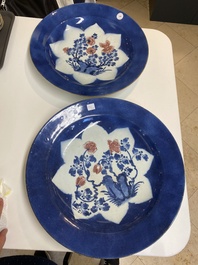 Three large Chinese blue, white and copper-red powder-blue-ground dishes with floral design, Kangxi