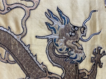 A Chinese yellow-ground silk embroidery decorated with sixteen five-clawed dragons, Da Ming 大明 mark, 19th C.
