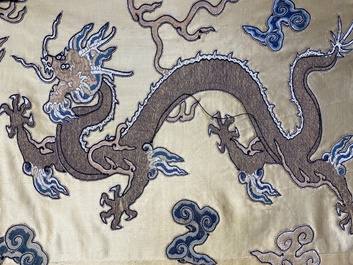 A Chinese yellow-ground silk embroidery decorated with sixteen five-clawed dragons, Da Ming 大明 mark, 19th C.