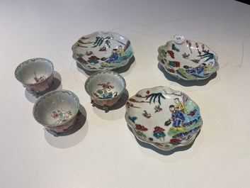 Three Chinese relief-decorated famille rose 'lotus' cups and saucers with a scholar and his servant, Yongzheng