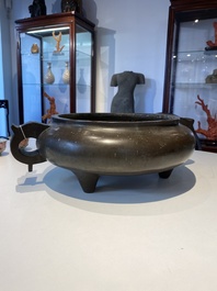 A very large Chinese bronze tripod censer, sixteen-character Xuande mark, 17/18th C.