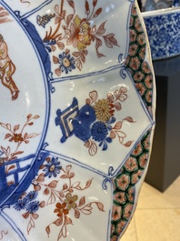 A large Chinese famille verte dish decorated with a European couple in a carriage, Kangxi