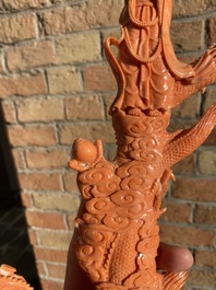 A Chinese red coral figure of a standing Bodhisattva with two dragons, 19/20th C.