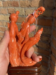 A Chinese red coral group of two ladies and a phoenix, 19/20th C.