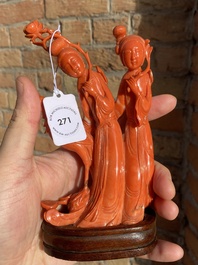 A Chinese red coral group of two ladies and a phoenix, 19/20th C.
