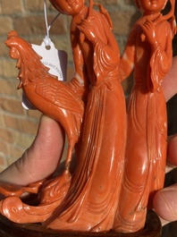 A Chinese red coral group of two ladies and a phoenix, 19/20th C.