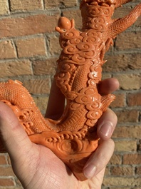 A Chinese red coral figure of a standing Bodhisattva with two dragons, 19/20th C.
