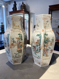 A pair of Chinese hexagonal famille rose 'mandarin subject' vases, Qianlong
