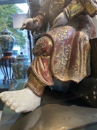 A large Chinese lacquered and polychromed wood sculpture of Guandi, 18th C.