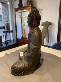 A large Sino-Tibetan bronze Buddha with traces of gilding, Ming