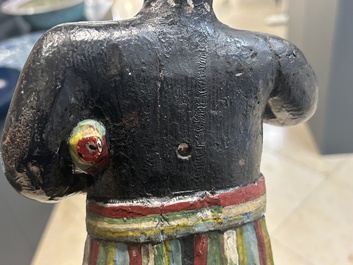 An English polychromed wood sculpture of a pipe-smoking Indian from a tobacco store, 18th C.