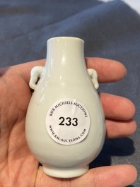 A small Chinese Dehua blanc de Chine elephant-handled 'hu' vase, 18th C.