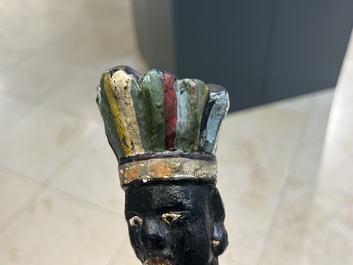 An English polychromed wood sculpture of a pipe-smoking Indian from a tobacco store, 18th C.