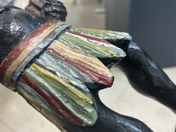 An English polychromed wood sculpture of a pipe-smoking Indian from a tobacco store, 18th C.