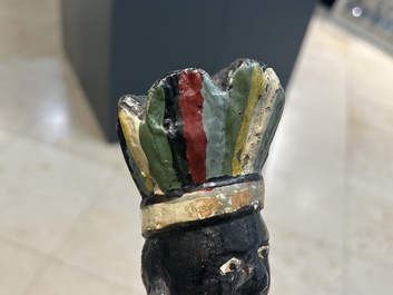 An English polychromed wood sculpture of a pipe-smoking Indian from a tobacco store, 18th C.