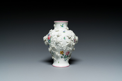 A Mennecy vase with applied floral design, France, DV mark, 18th C.