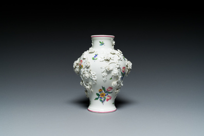 A Mennecy vase with applied floral design, France, DV mark, 18th C.