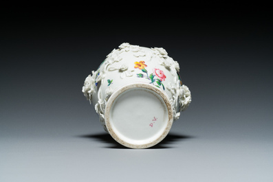 A Mennecy vase with applied floral design, France, DV mark, 18th C.