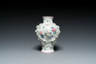 A Mennecy vase with applied floral design, France, DV mark, 18th C.