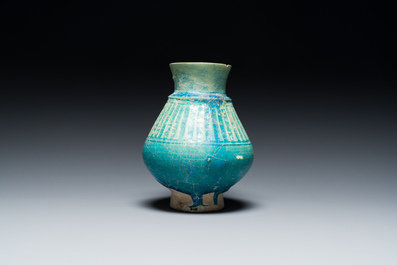 A turquoise-glazed jug, Kashan, Persia, 13th C.