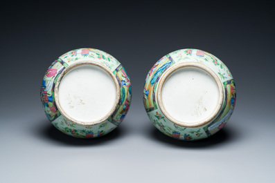 A pair of Chinese Canton famille rose celadon-ground vases, 19th C.