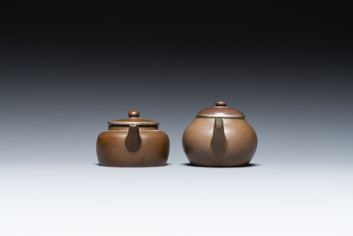 Two Chinese Yixing stoneware teapots and covers with brass mounts, one with Yigong 逸公 seal mark, 19/20th C.