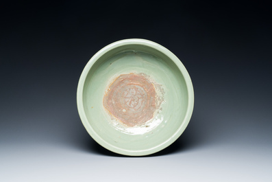 A Chinese Longquan celadon tripod censer with underglaze decoration, Ming
