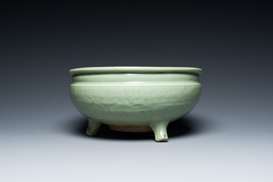 A Chinese Longquan celadon tripod censer with underglaze decoration, Ming