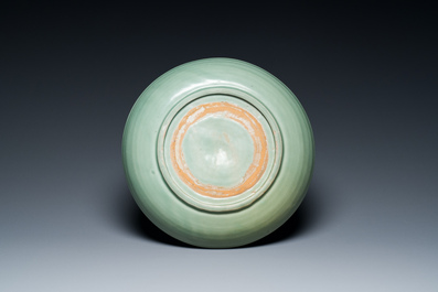A Chinese Longquan celadon dish with underglaze floral design, Ming