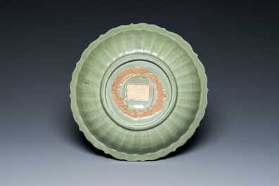 A Chinese Longquan celadon lotus-form dish with underglaze floral design, Ming