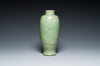 A Chinese Longquan celadon vase with underglaze floral design, Ming