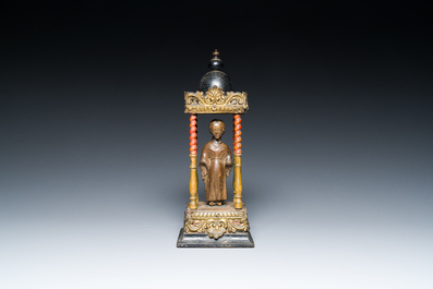 An Italian carved wood figure of a monk mounted in a later pagoda, 14th and 19th C.