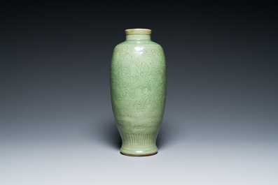 A Chinese Longquan celadon vase with underglaze floral design, Ming