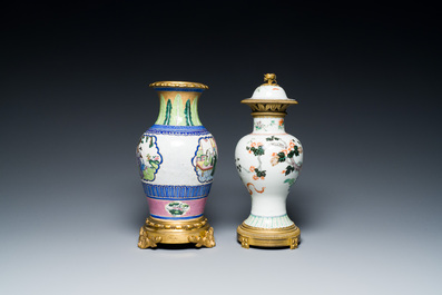 A Chinese famille verte vase and an enamelled Yixing stoneware vase with gilt bronze mounts, 19th C.