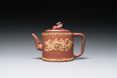 A Chinese Yixing stoneware teapot and cover with an applied dragon, Kangxi