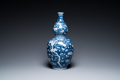 A Chinese blue and white double gourd 'prunus on cracked ice' vase, 18th C.