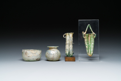 Two Roman glass balsamariums, a flask and a bowl, 2nd/4th C.