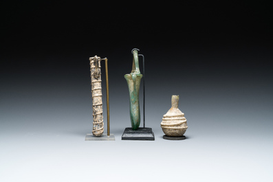 Two Roman glass balsamariums and a flask, 2nd/4th C.