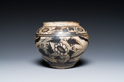 A Chinese Cizhou pottery jar with floral design, Song