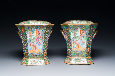 A pair of Chinese Canton famille rose flower holders and covers, 19th C.