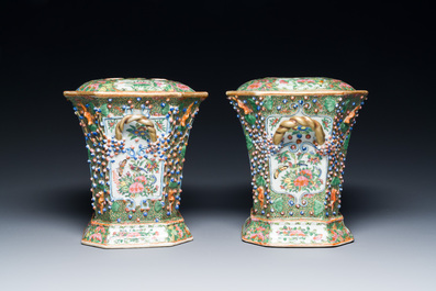 A pair of Chinese Canton famille rose flower holders and covers, 19th C.