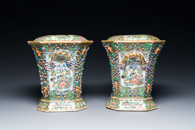 A pair of Chinese Canton famille rose flower holders and covers, 19th C.