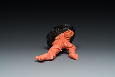 A Chinese red coral group of a lady and a boy, 19/20th C.