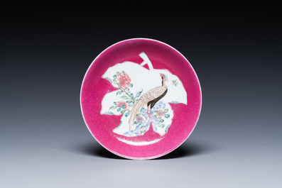 A Chinese famille rose ruby-pink-ground 'pheasants' cup and saucer, Yongzheng