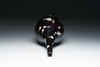 A Chinese black-glazed reverse-decorated bottle vase, 19th C.