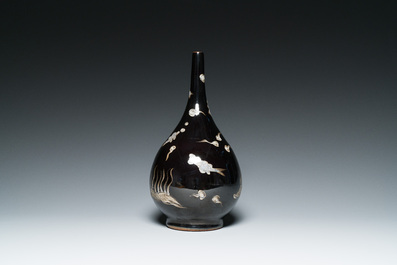 A Chinese black-glazed reverse-decorated bottle vase, 19th C.