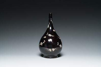 A Chinese black-glazed reverse-decorated bottle vase, 19th C.